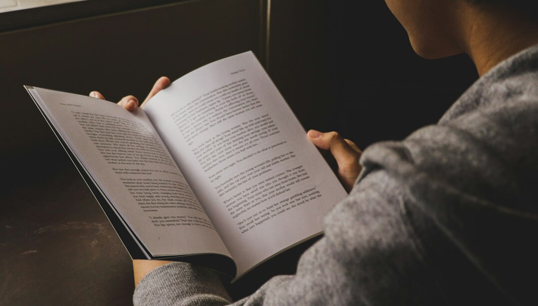 person studying japanese textbook