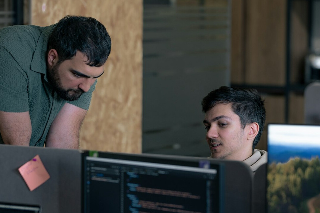 team discussing code in office