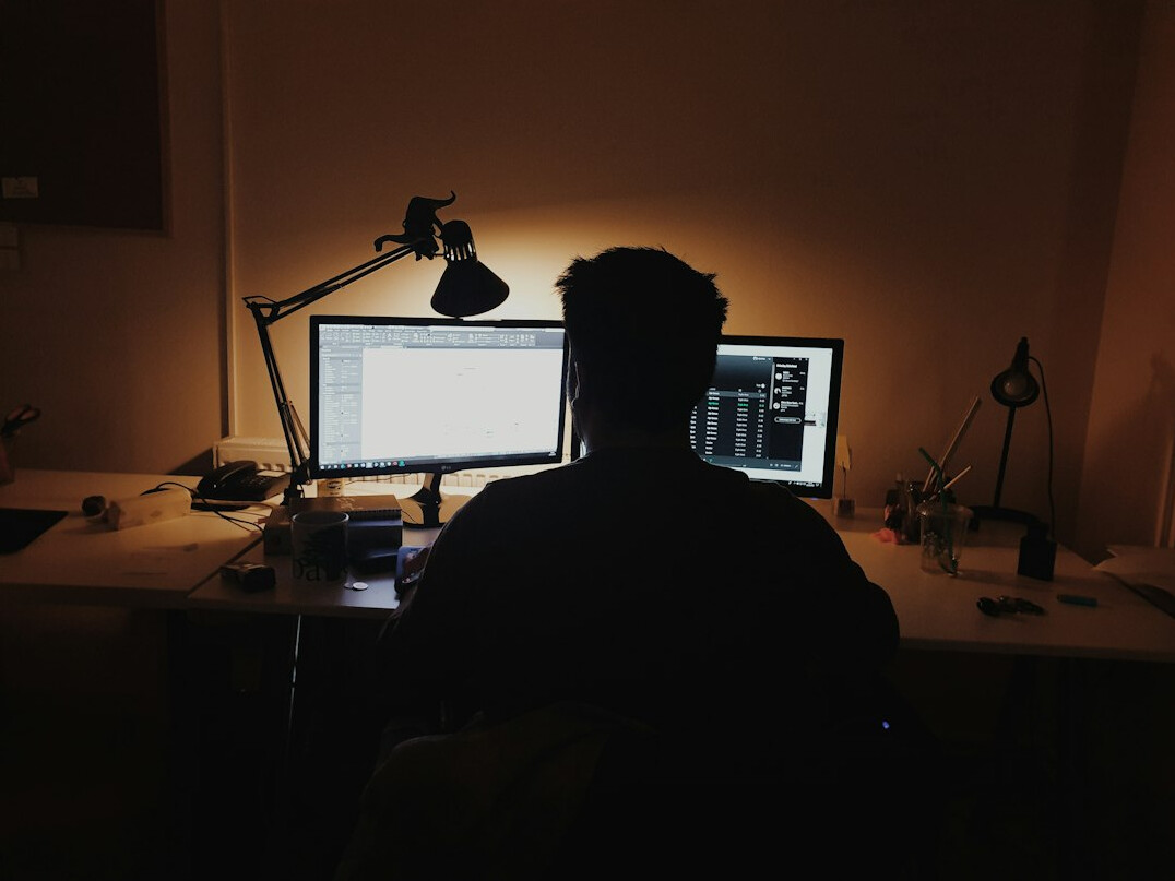 japanese programmer at desk