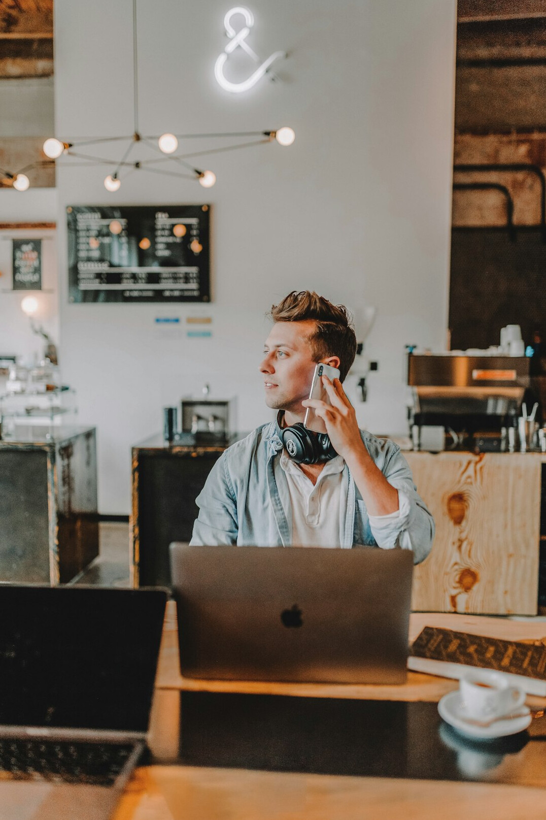 person working on laptop at cafe