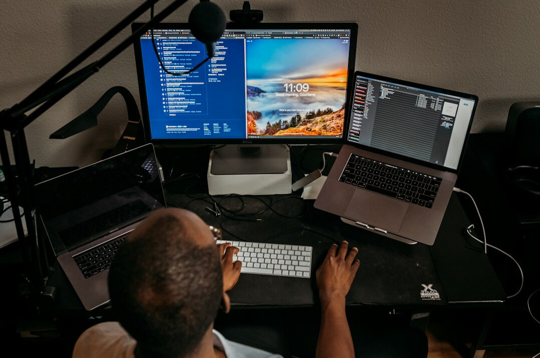 person coding at desk